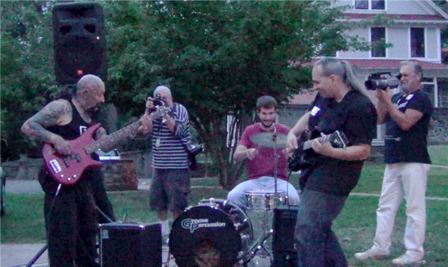 Batso's debut performance on bass with music teacher Jim Clark on guitar and fellow student Tommy on drums at 80th birthday bash